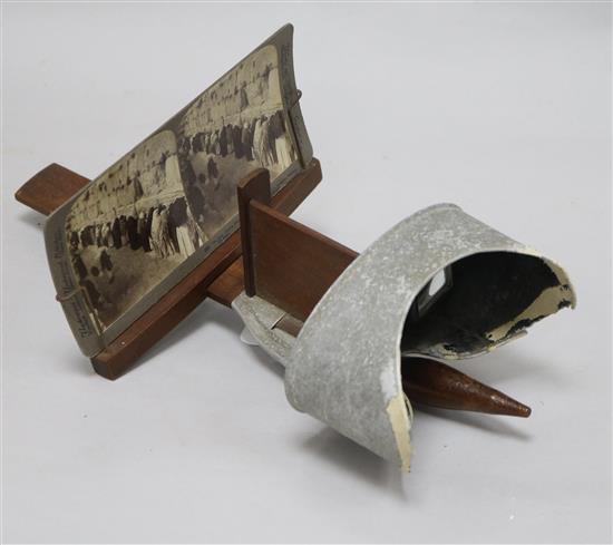 A stereoscope viewer and cards